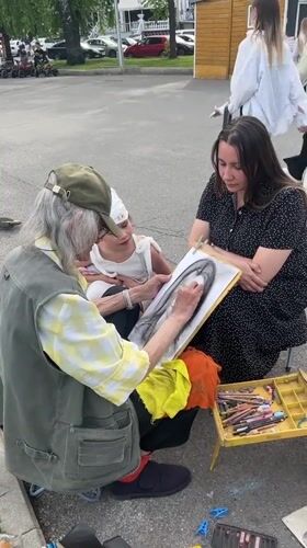 Street artist draws portraits in public square, Ufa