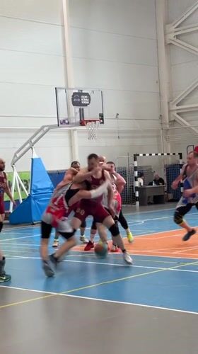 Basketball game underway in Mayma, Russia indoor court