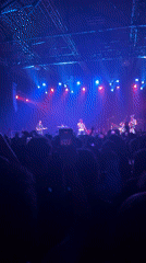 Live band performs under colored stage lights in Buenos Aires venue
