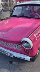 Morning scenes captured in Sofia: decorated car, woman near tracks