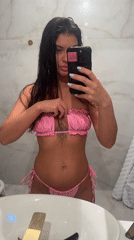 Woman takes bathroom mirror selfie in Khimki, Russia