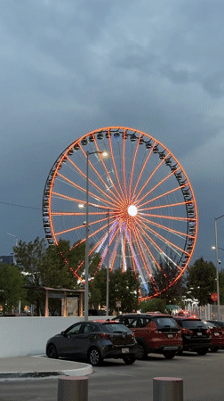 Woman enjoys green popsicle in late-night Puebla moment