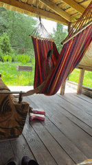 Mother and child play with slinky toy on porch