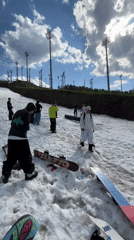 Group moves large pipes across snowy terrain in Krasnoyarsk