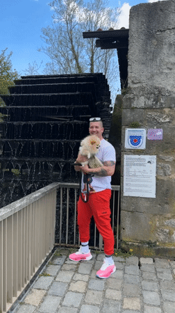 Man with dog visits historic watermill in Besigheim