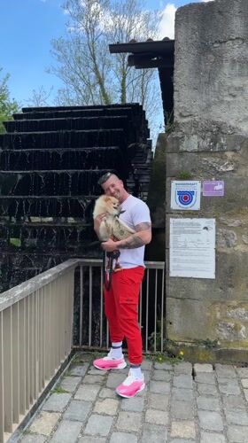 Man with dog visits historic watermill in Besigheim