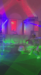 Silver-clad performers roller skate at MCM event in Milan