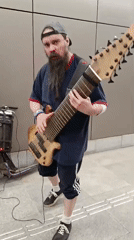 Moscow street scenes: musician plays bass, person carries balloons