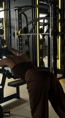 Woman exercises with weights at Krasnoyarsk gym early morning
