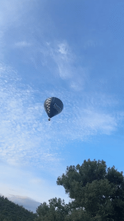 Dentus-branded hot air balloon drifts over Ciorescu, Moldova