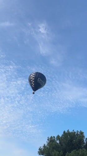 Dentus-branded hot air balloon drifts over Ciorescu, Moldova