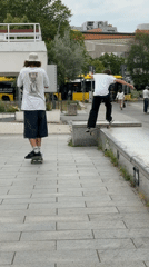 Skaters hit concrete ledges at a Berlin plaza