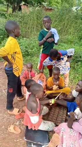 Children gather for outdoor play activities in Ngalula, DRC