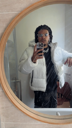 Young man takes mirror selfies in Massy bathroom
