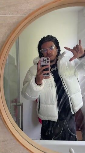 Young man takes mirror selfies in Massy bathroom