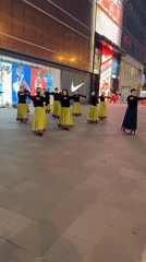 Women perform synchronized dance routine on Beijing plaza