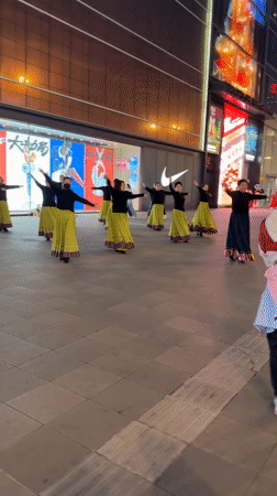 Women perform synchronized dance routine on Beijing plaza