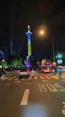 Illuminated monument with color-changing statue observed in Paris