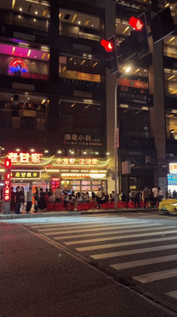 Nighttime street activity recorded in Yuzhong District, China