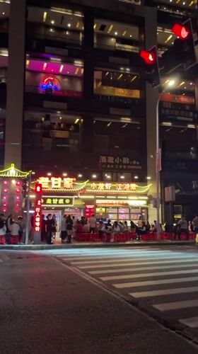 Nighttime street activity recorded in Yuzhong District, China