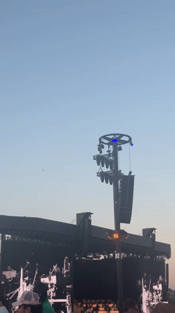 Daytime outdoor concert features vintage performance footage in La Quinta