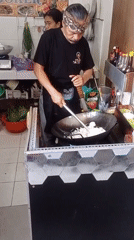 Batu market closing time, wok fires still going