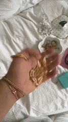 London resident catalogs jewelry collection in bedroom documentation session