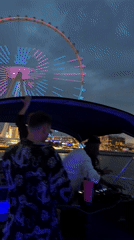 Nighttime boat party with DJ spotted near Dubai Ferris wheel