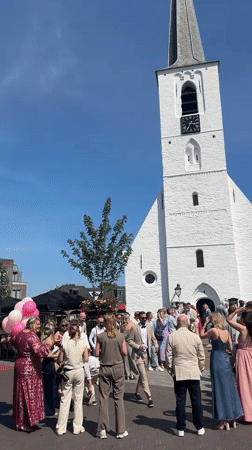 Wedding celebration at white church in Noordwijk Netherlands