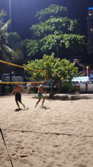 Nighttime beach bar scene with volleyball and coastal vibes