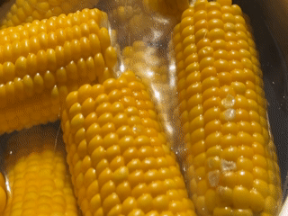 Corn boiling, drinks in hand — a summer cookout in Germany
