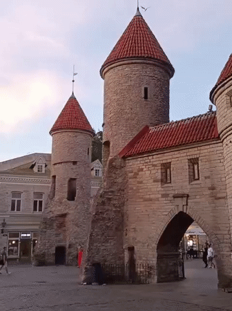 Tallinn's medieval gate towers and cobblestone plaza