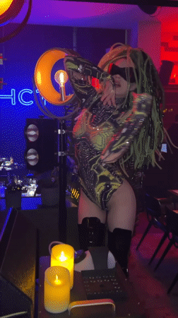 Green-haired dancer performs at Novosibirsk nightclub celebration with sparklers