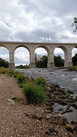 Bolesławiec's stone railway viaduct spans the Bóbr River