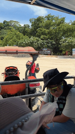 Beach resort morning in Ao Nang — boats, trikes, and departures
