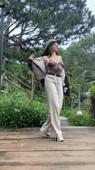 Posing and dancing on a wooden platform in Da Lat's greenery