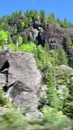 Vehicle passes through rocky terrain near Sproat Lake, BC