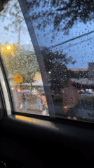 Rain obscures city view from car windows in Davao