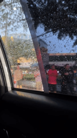 Rain obscures city view from car windows in Davao