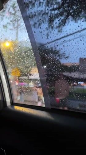 Rain obscures city view from car windows in Davao