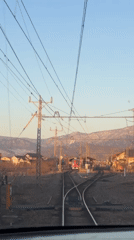 Train passenger films approach to Obuse station, red train visible