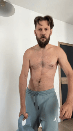Home workout session with kettlebells and skateboard in Vsevolozhsk