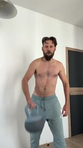 Home workout session with kettlebells and skateboard in Vsevolozhsk