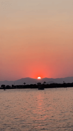 Sunset from a wooden pier over Fethiye's waterfront