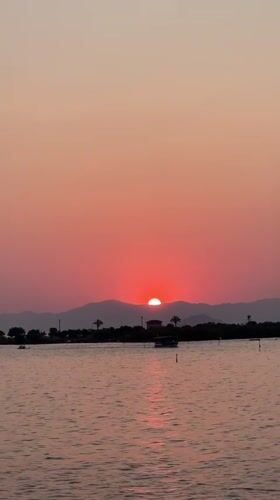 Sunset from a wooden pier over Fethiye's waterfront