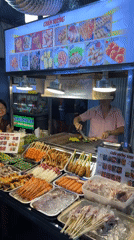 Night market food vendors serve fresh seafood in Thủ Đức