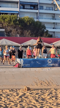 Beachside fitness class on a raised platform in Quarteira