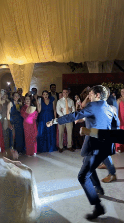 Wedding celebration with bouquet toss captured in Orizaba courtyard