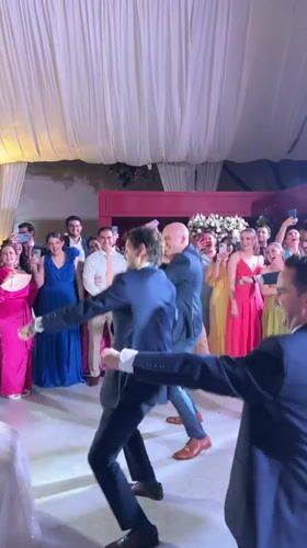 Wedding celebration with bouquet toss captured in Orizaba courtyard