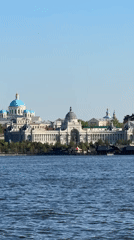 Kazan waterfront cityscape with ornate domed buildings observed